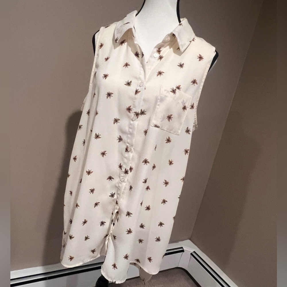 Cream button down top with bumblebee pattern.
